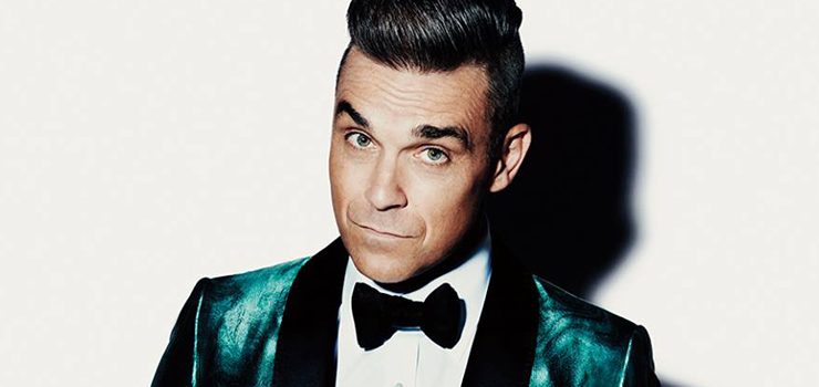 “Manchester we’re strong”: Robbie Williams dedica “Angels” alle vittime dell’attentato e si commuove